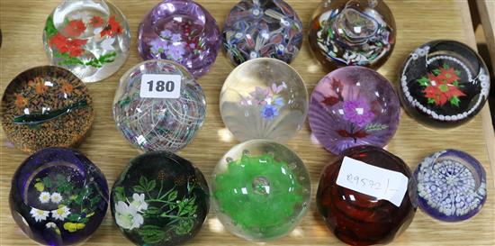 Fourteen glass paperweights including some Caithness